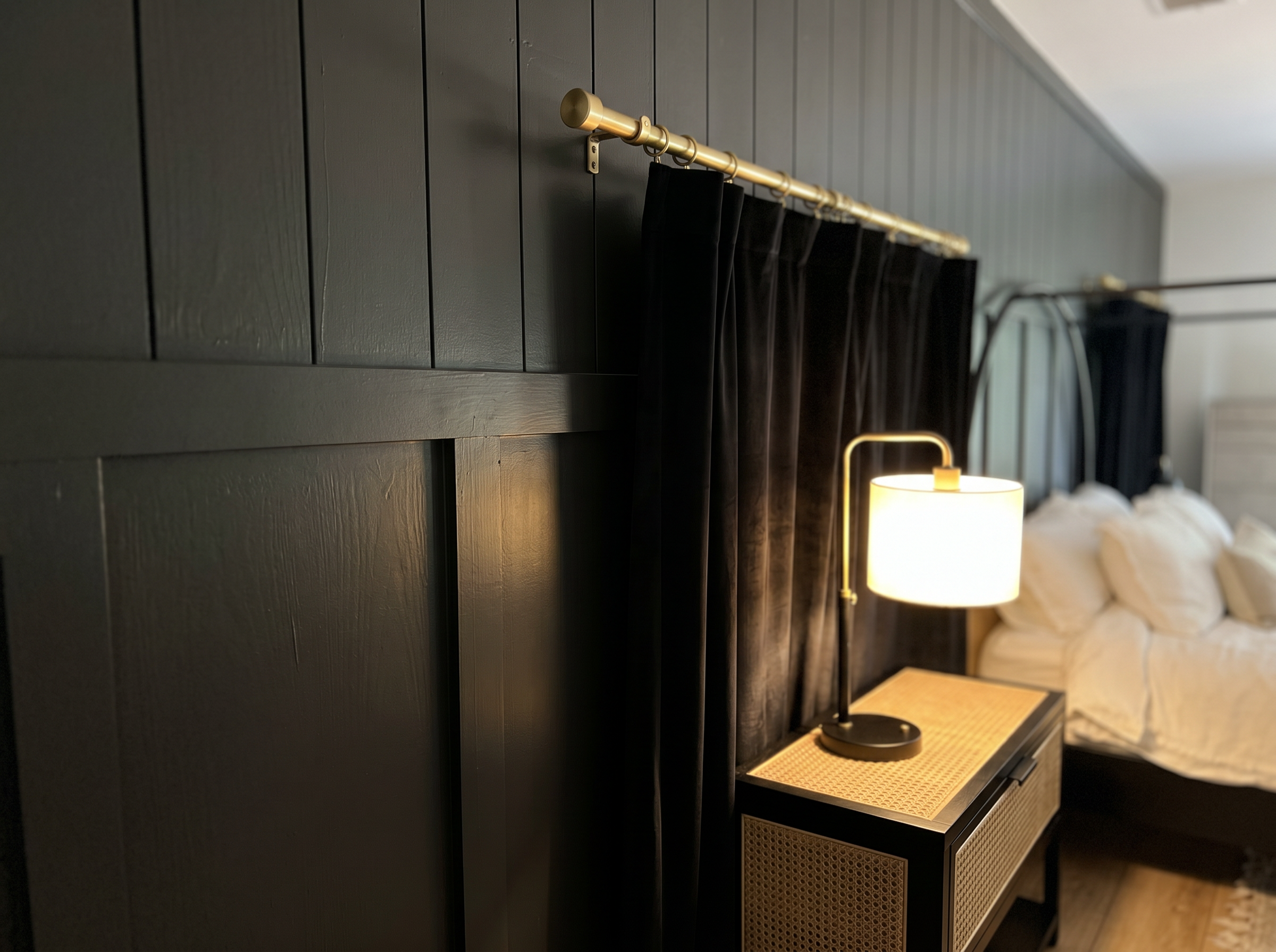 Custom dark shiplap accent wall in primary bedroom — premium wood paneling detail — May Construction